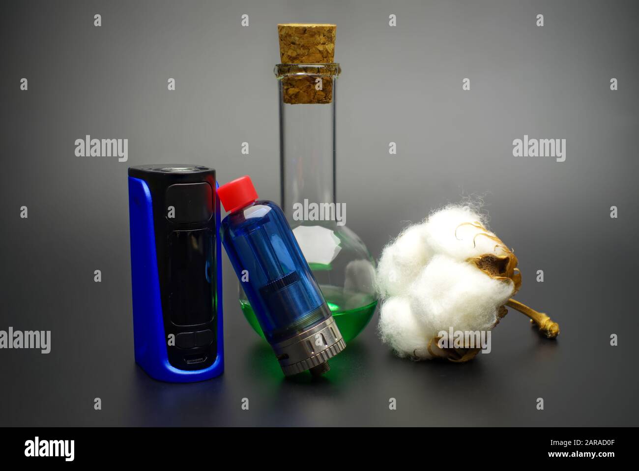 Electronic cigarette or vaping devices with natural cotton, cork stopped  flask with vape liquid Stock Photo - Alamy