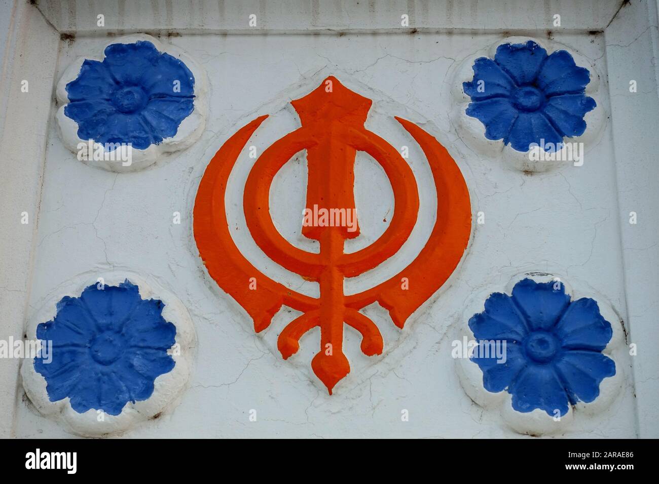The Khanda a symbol of the Sikh faith - Sikhism or Sikhi is a Indian monotheistic religion that originated in the Punjab region Stock Photo