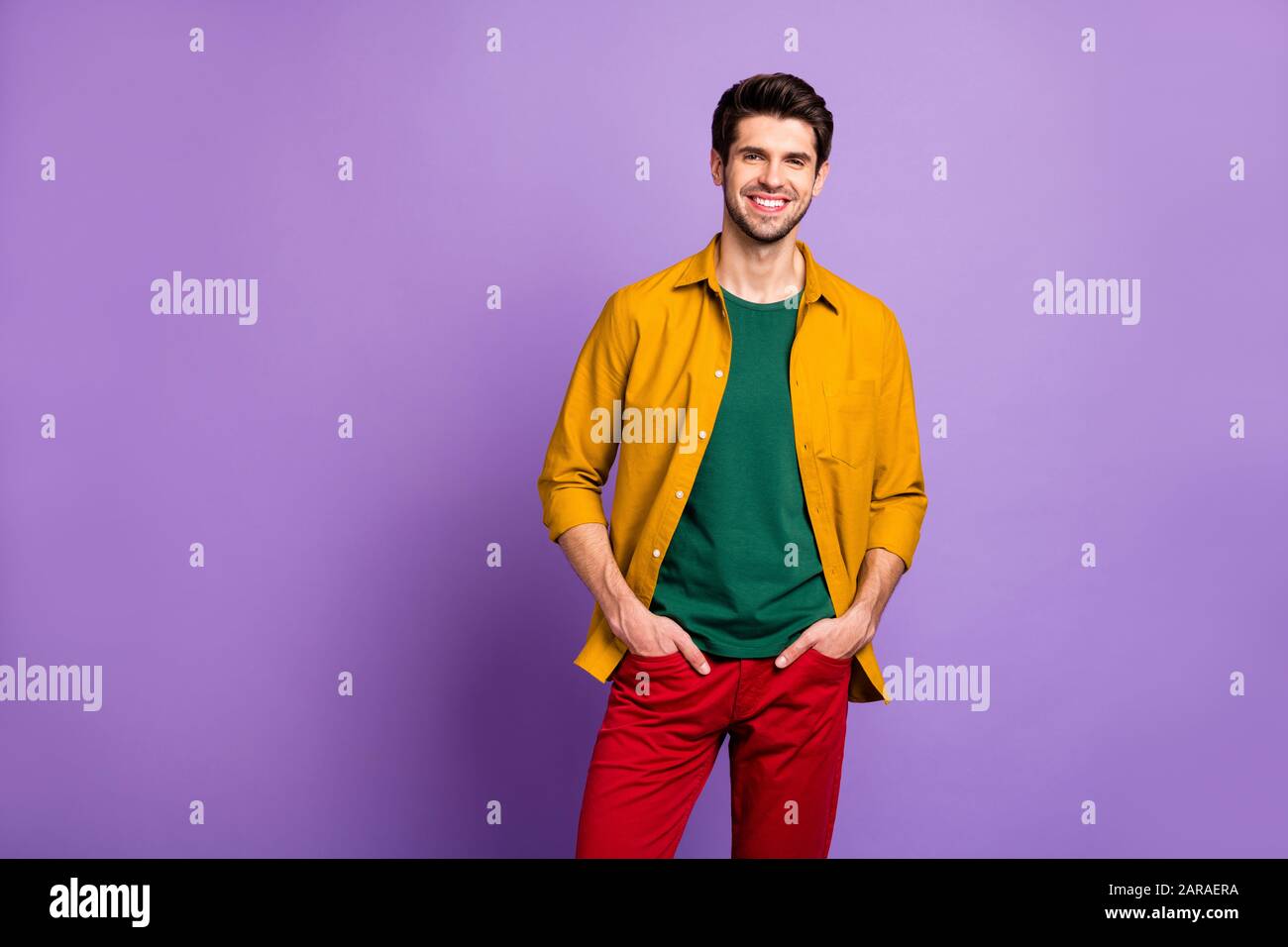 Photo Of Cheerful Positive Handsome Attractive Man Wearing Green T