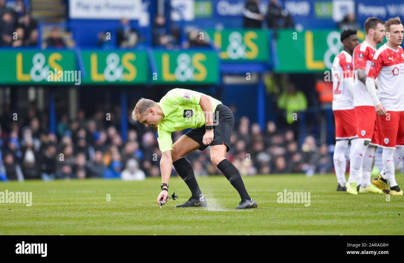 Referee Graham Scott marks up a free-kick during the Emirates FA Cup fourth round match between Portsmouth and Barnsley at Fratton Park ,  Portsmouth, UK - 25th January 2020 - Editorial use only. No merchandising. For Football images FA and Premier League restrictions apply inc. no internet/mobile usage without FAPL license - for details contact Football Dataco  : Stock Photo