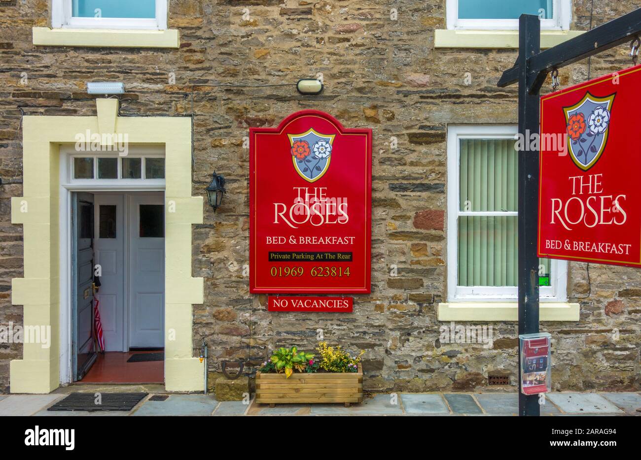 Outside and entrance to The Roses, a bed & breakfast establishment in the market town of Leyburn, in Richmondshire, North Yorkshire, England, UK. Stock Photo