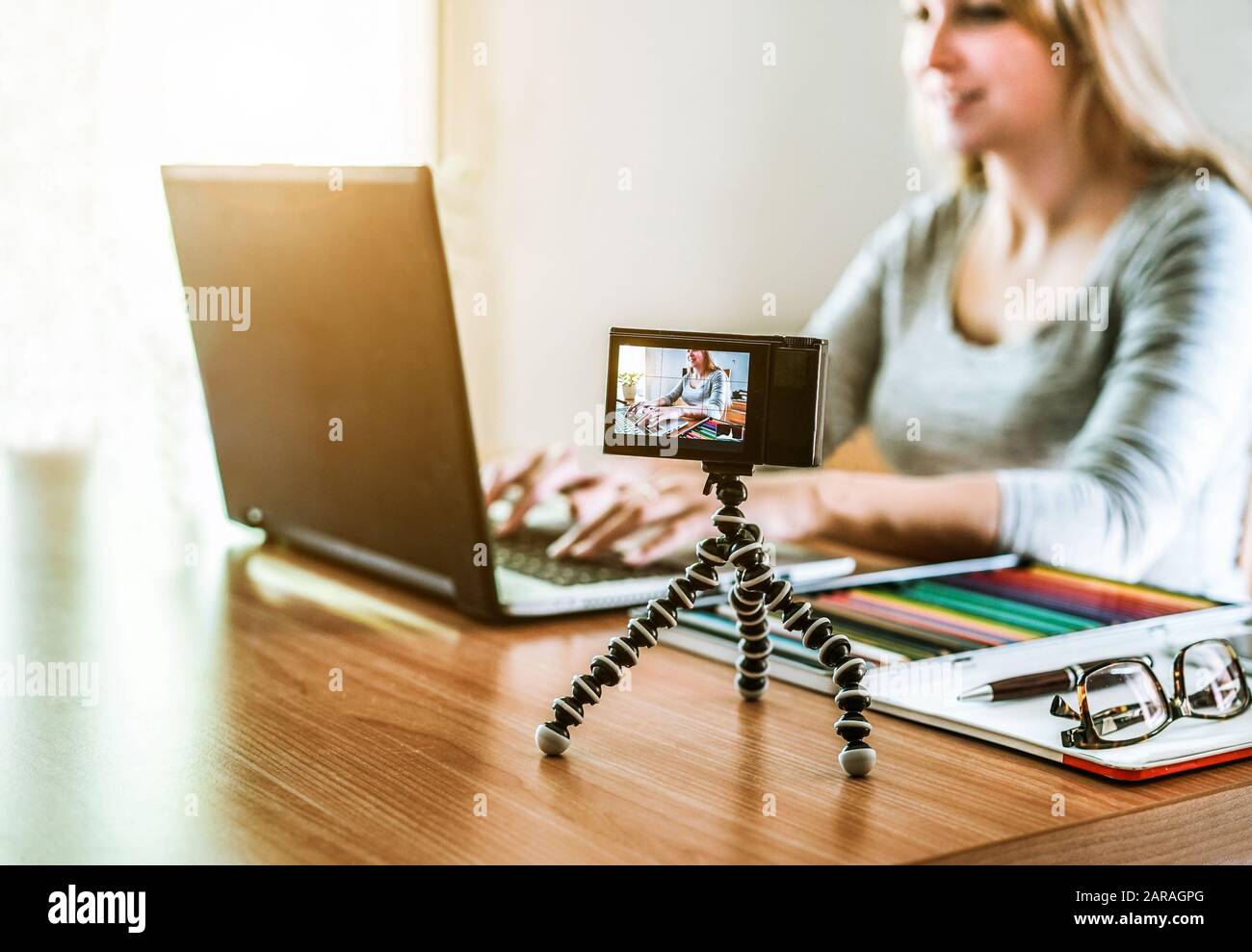 Actress Using Computer Woman vlogger looking using laptop computer and filming on video her ...