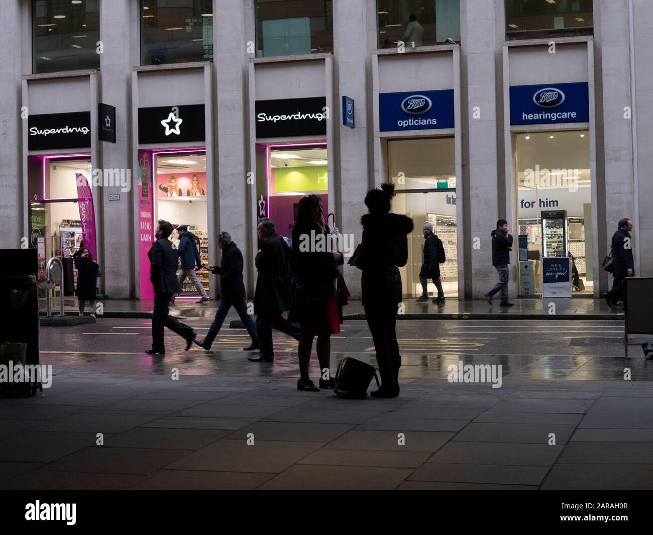 Superdrug and Boots rival high street chemist chains, compete for business in the City of London Uk Stock Photo