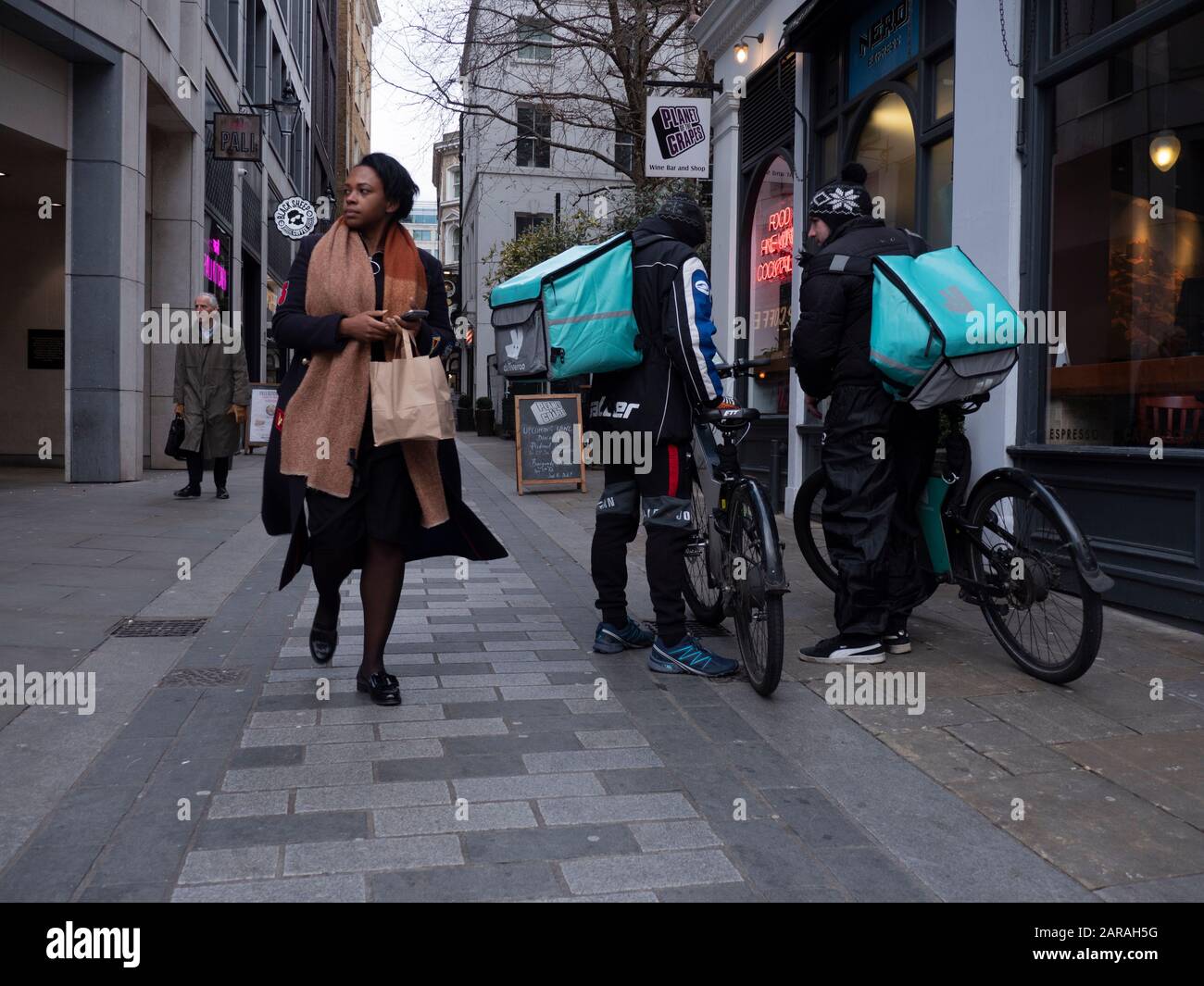 Deliveroo bike delivery riders waiting for food City of London