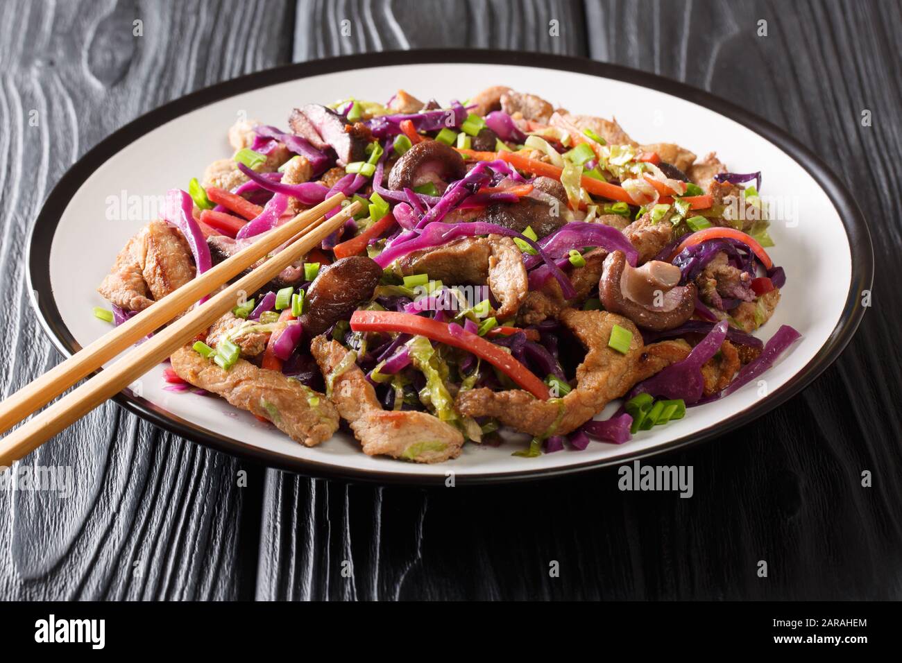 Moo shu pork recipe with vegetables and mushrooms close-up in a plate on the table. horizontal Stock Photo