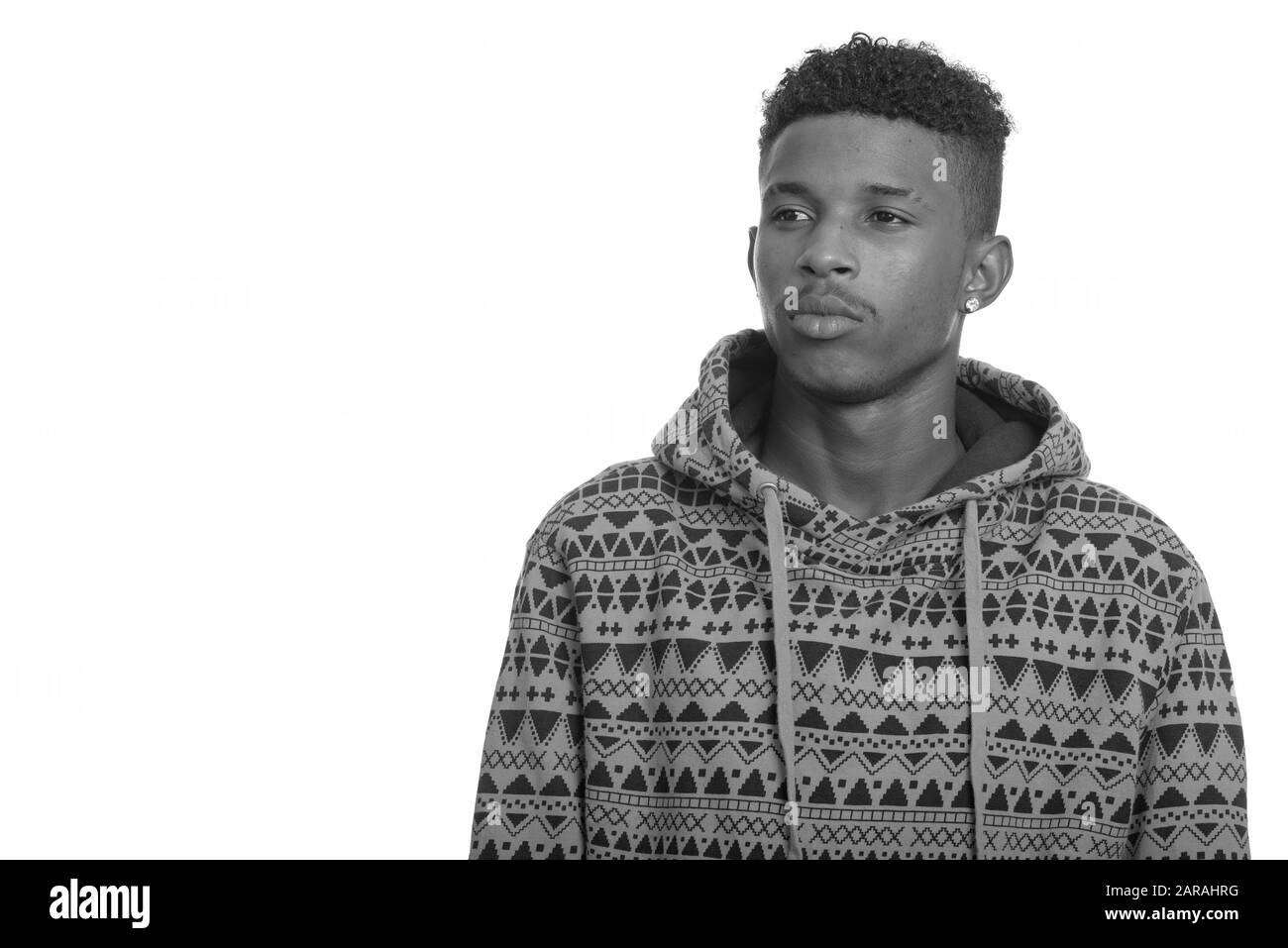 Studio shot of young handsome African man with Afro hair isolated against  white background in black and white Stock Photo - Alamy