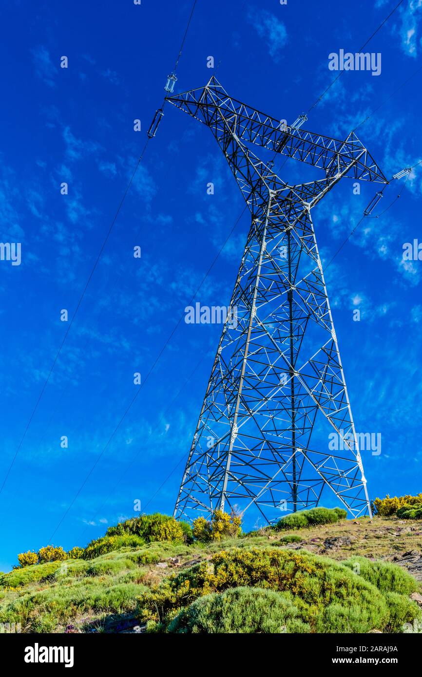 High-voltage tower on a blue sky background Stock Photo - Alamy