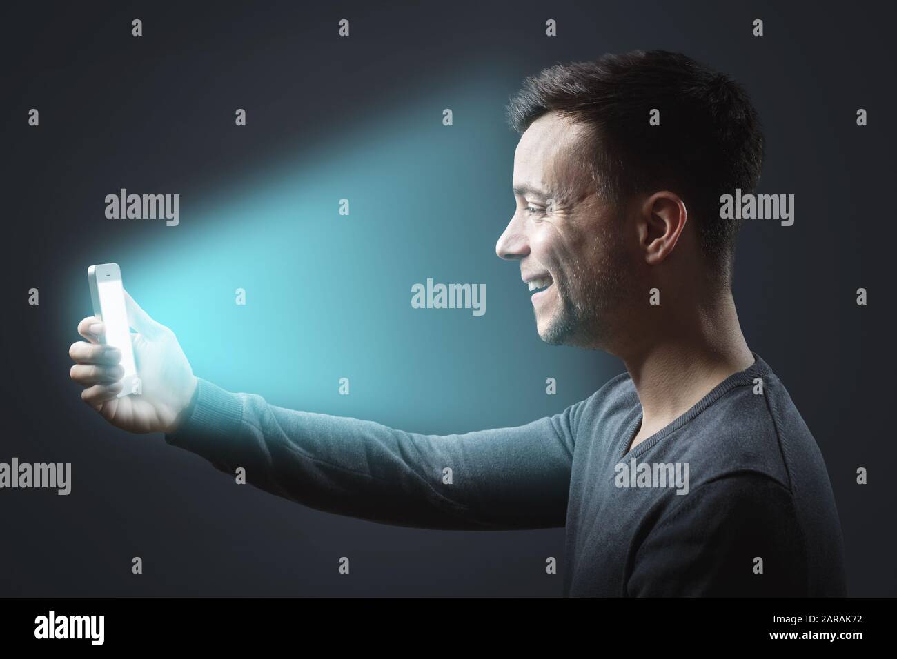 Man Using Cell Phone Light Face Portrait phone glow hi-res stock photography and images - Alamy