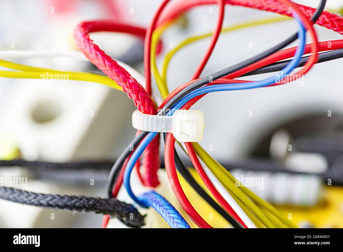 Multicolored electrical cables isolated close up. Selective focus. Stock Photo