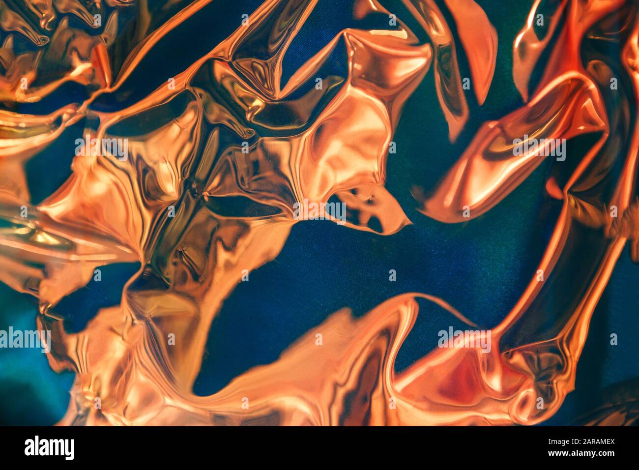 Abstract holographic background in bright gold shades of color Stock