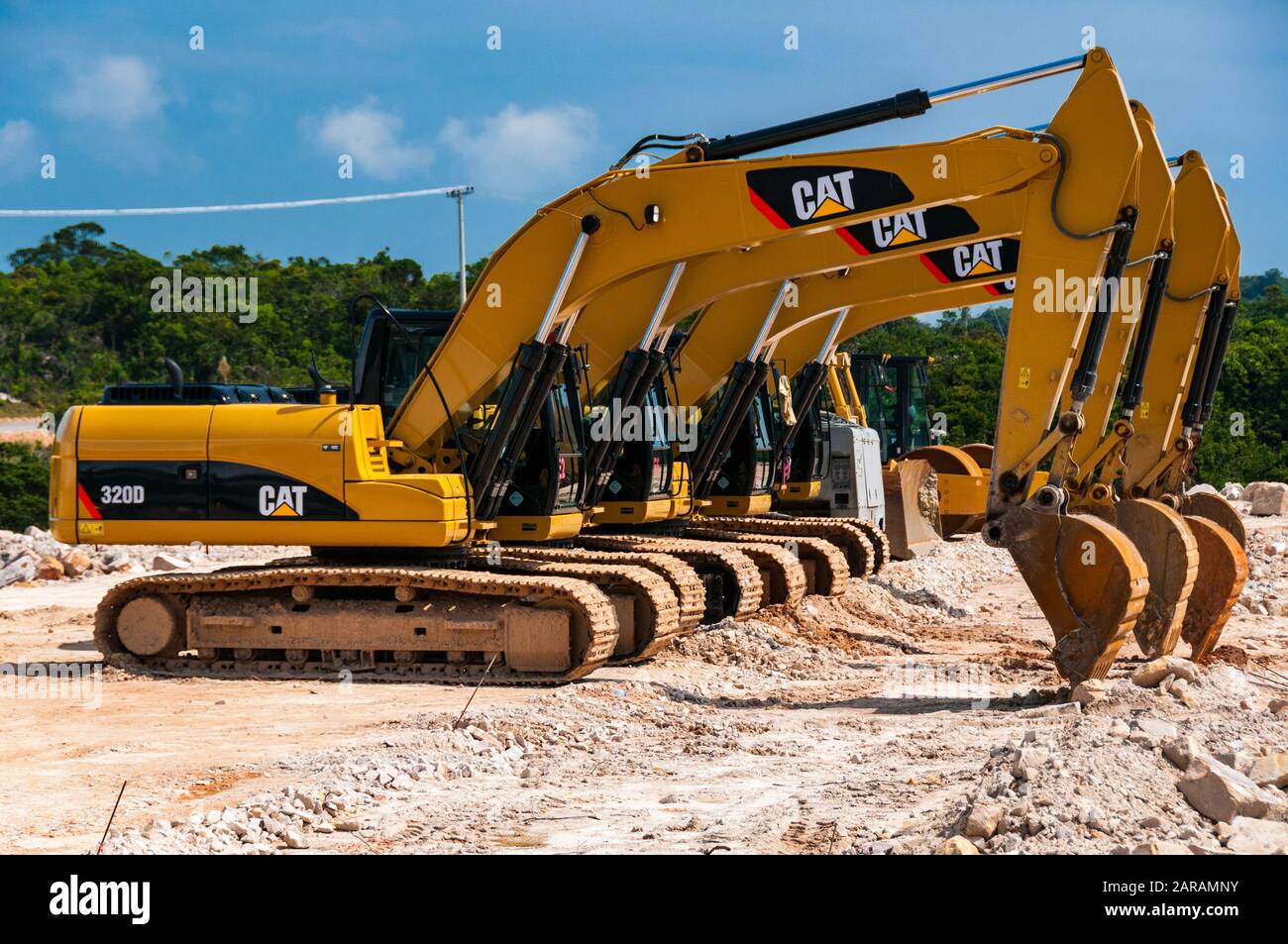 Infrastructure Bill A-row-of-caterpillar-320d-excavators-taking-a-break-from-constructing-a-new-casino-in-cambodia-other-caterpillar-equipment-bokor-hill-station-2ARAMNY