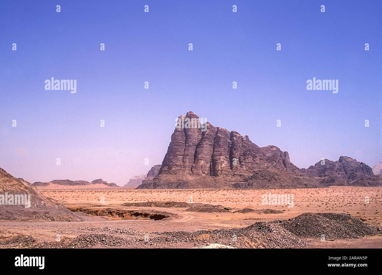Jordan. Colourful scenes at the UNESCO World Heritage Site of Wadi Rum near the port of Aqaba in southern Jordan looking towards the Seven Pillars of Wisdom mountain associated with Lawrence of Arabia. Stock Photo