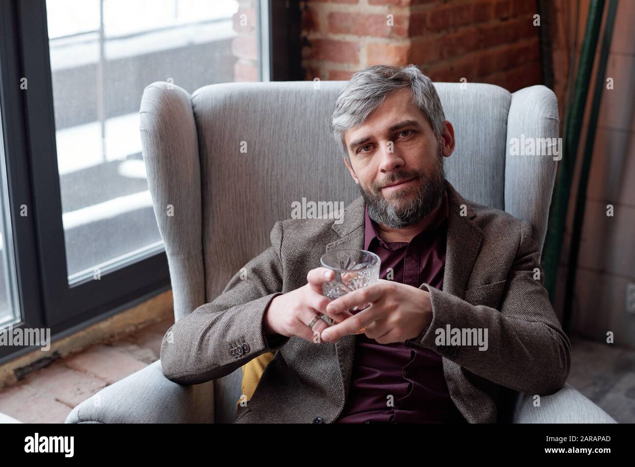 Bearded man with whisky glass Stock Photo