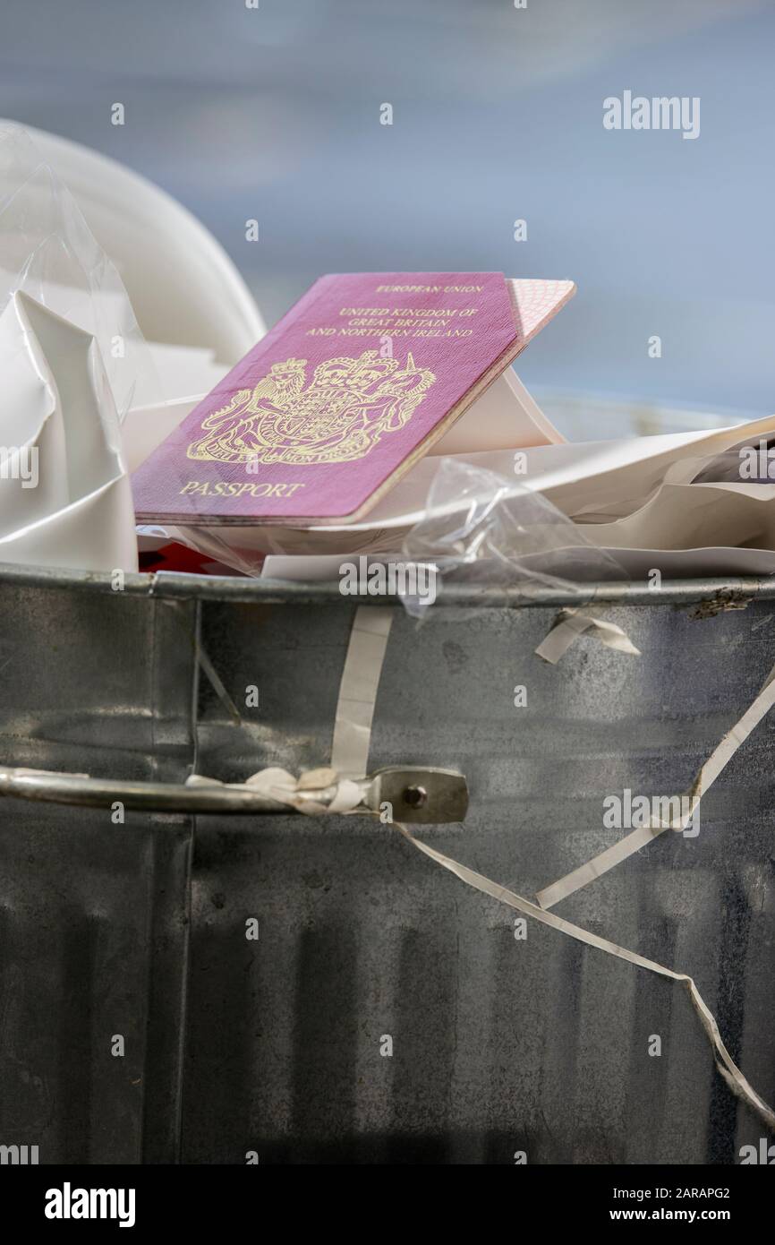 Out with the trash: A cancelled European Union Passport hits the bin ahead of Britain leaving the EU on the 31st January 2020. Stock Photo
