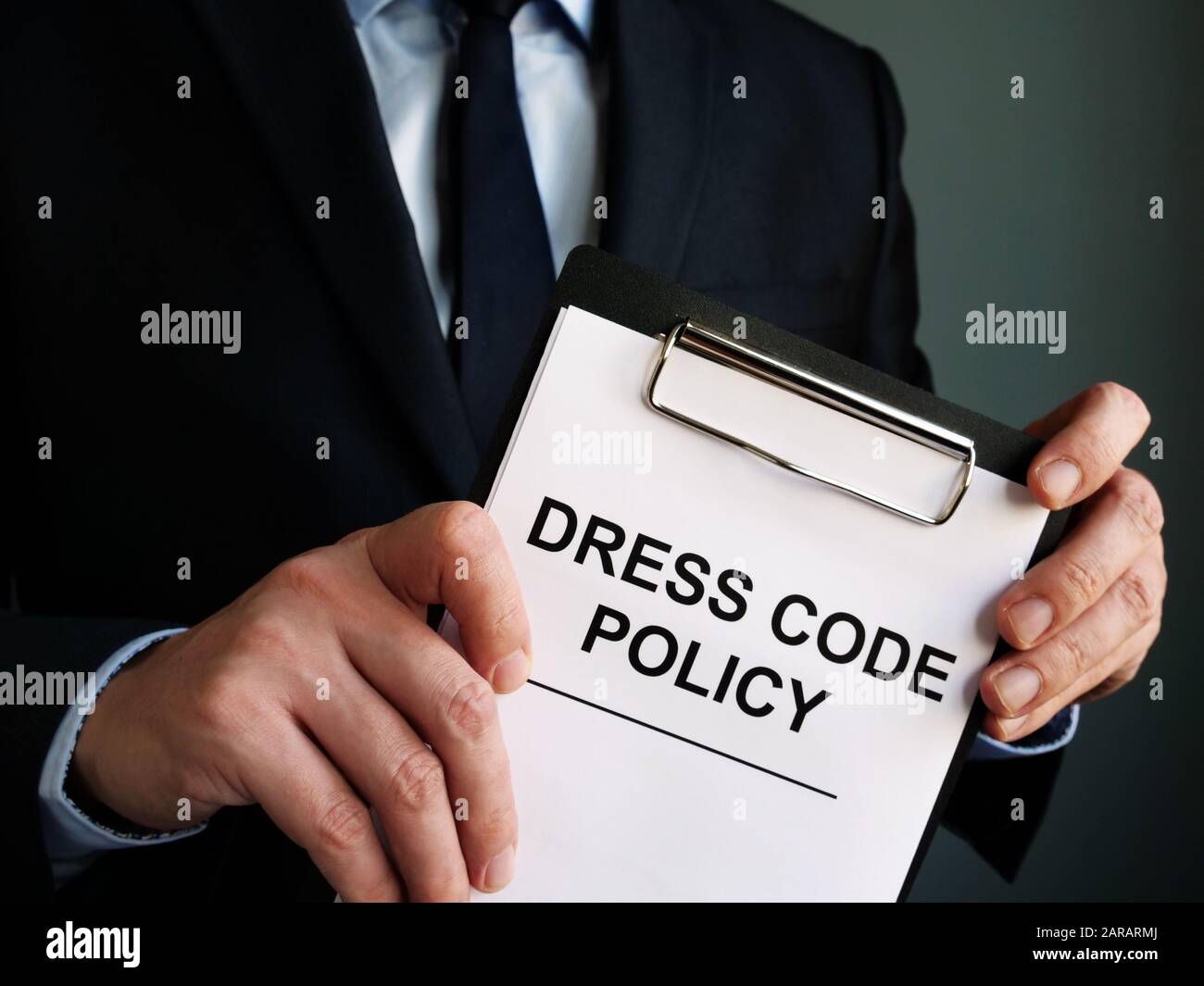 Manager is holding Dress code policy. Stock Photo