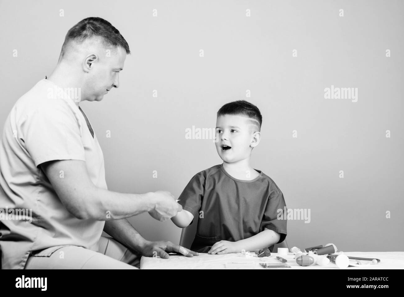 medicine and health. happy child with father with stethoscope. father