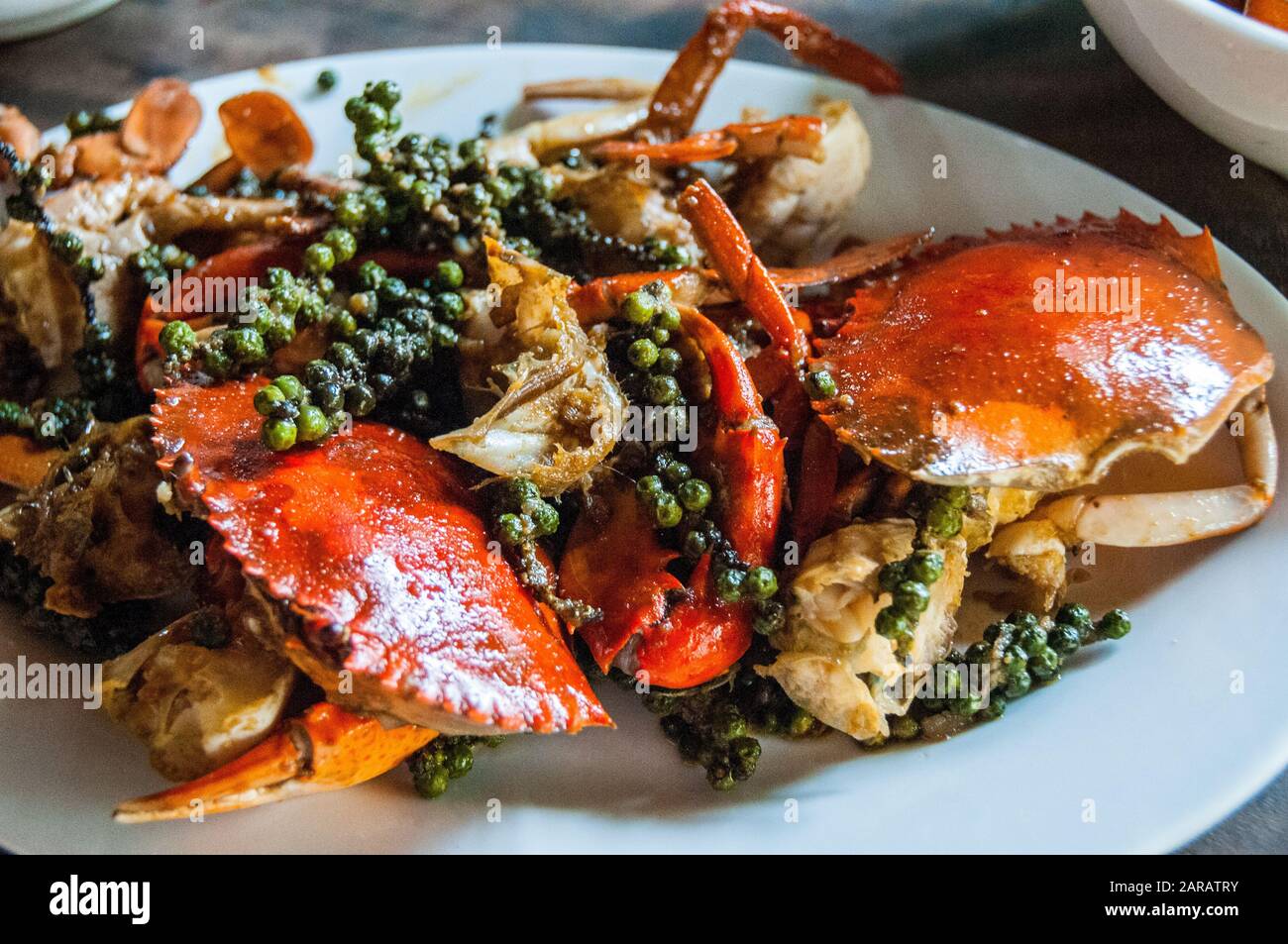 Cooking Kampot pepper crab at a small café in Kampot. The crabs are