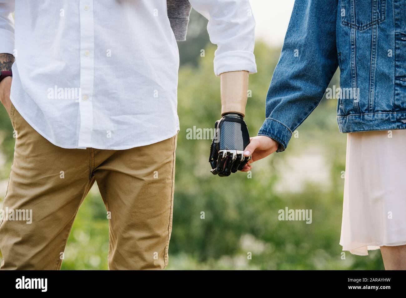 Happy married middle age couple holding hands in a park Stock Photo