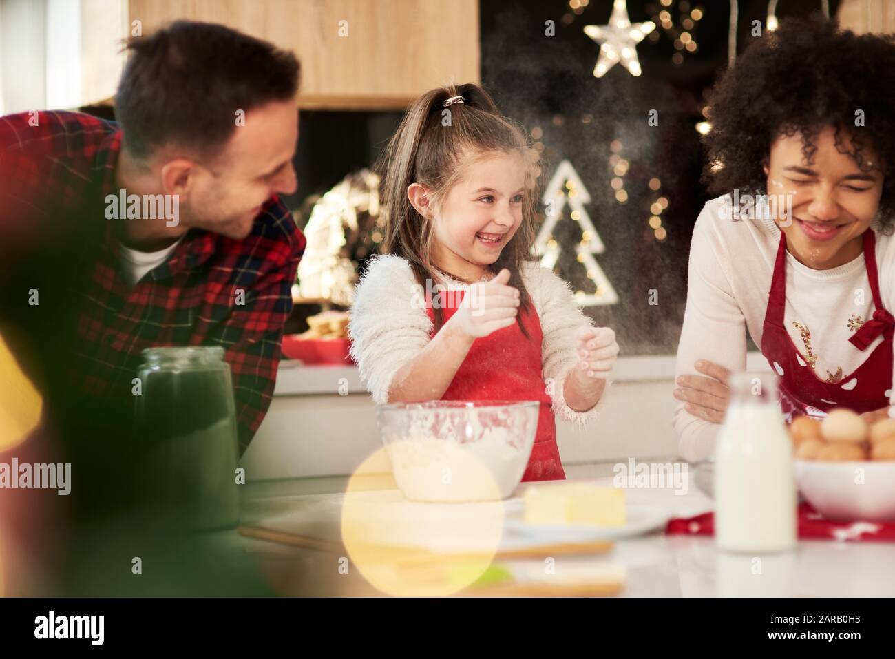 Family enjoying in the kitchen at Christmas Stock Photo