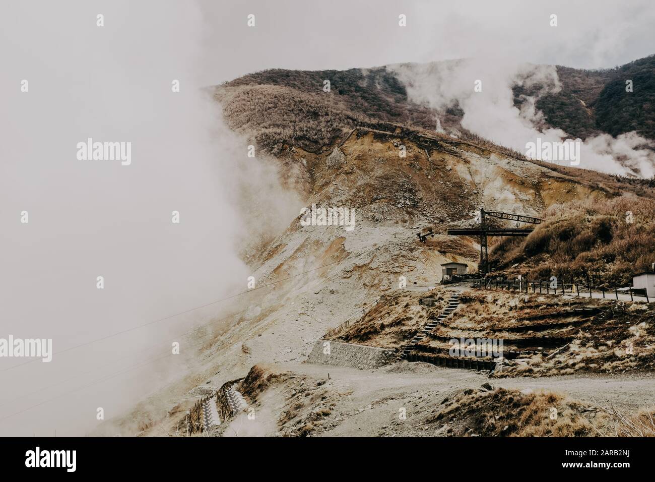 Duotone image of sulfur Mining activity in a mountainside photographed in Japan Stock Photo