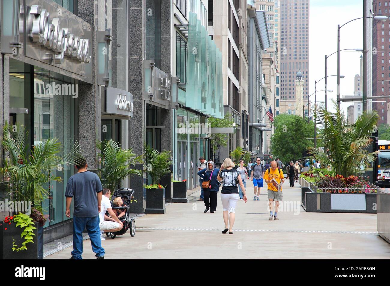 CHICAGO, USA - JUNE 26, 2013: People walk the famous Magnificent Mile of Michigan Avenue in Chicago. It is Chicago's major shopping destination and on Stock Photo