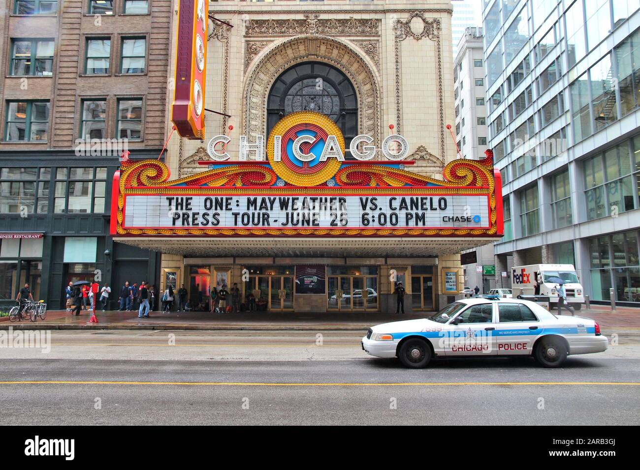 CHICAGO, USA - JUNE 26, 2013: People visit Chicago Theatre. It was founded in 1921 and is a registered Chicago Landmark. Stock Photo