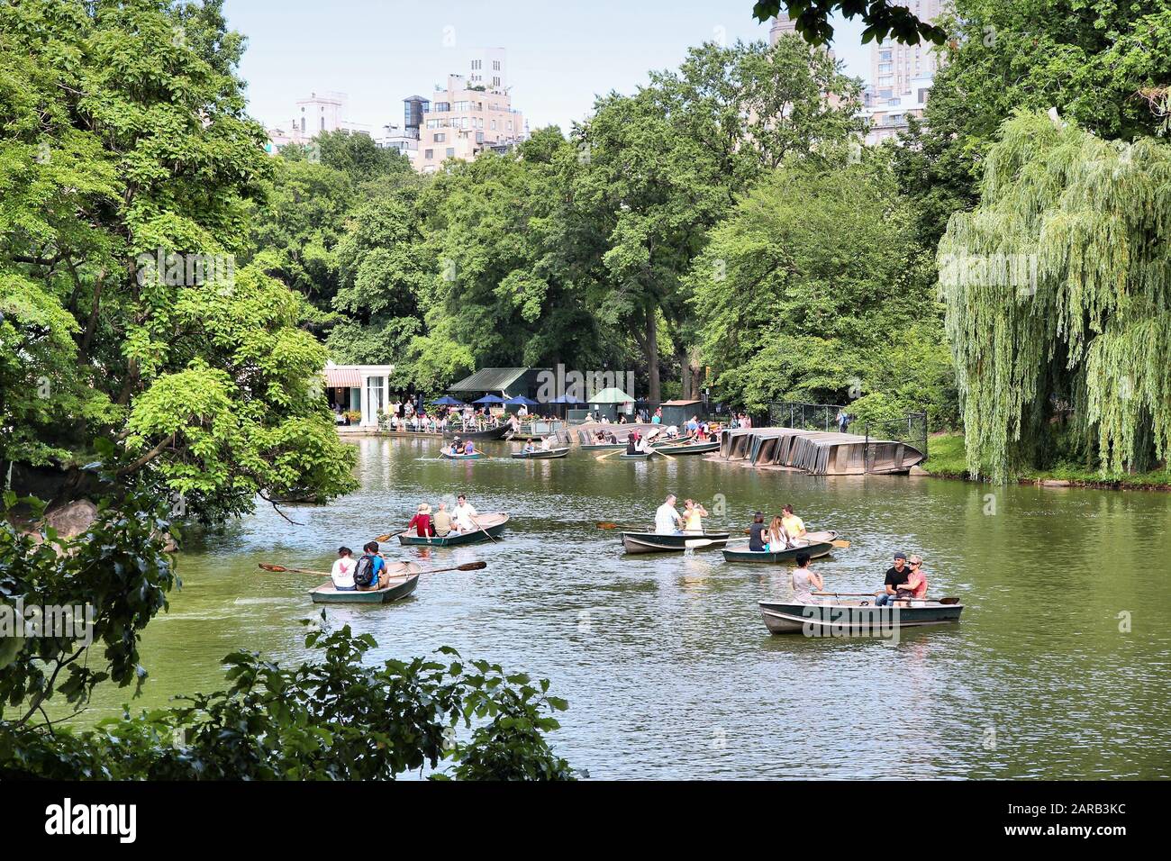 NEW YORK, USA - JULY 2, 2013: People visit Central Park in New York. Park opened in 1857 and covers 840 acres of land today. Stock Photo