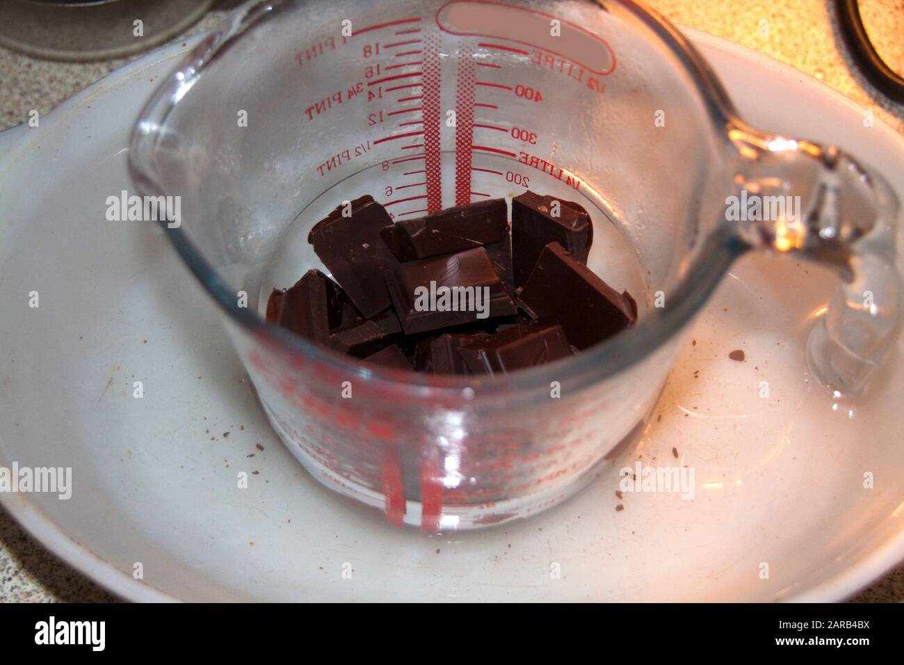 Melting Chocolate in the Kitchen Stock Photo