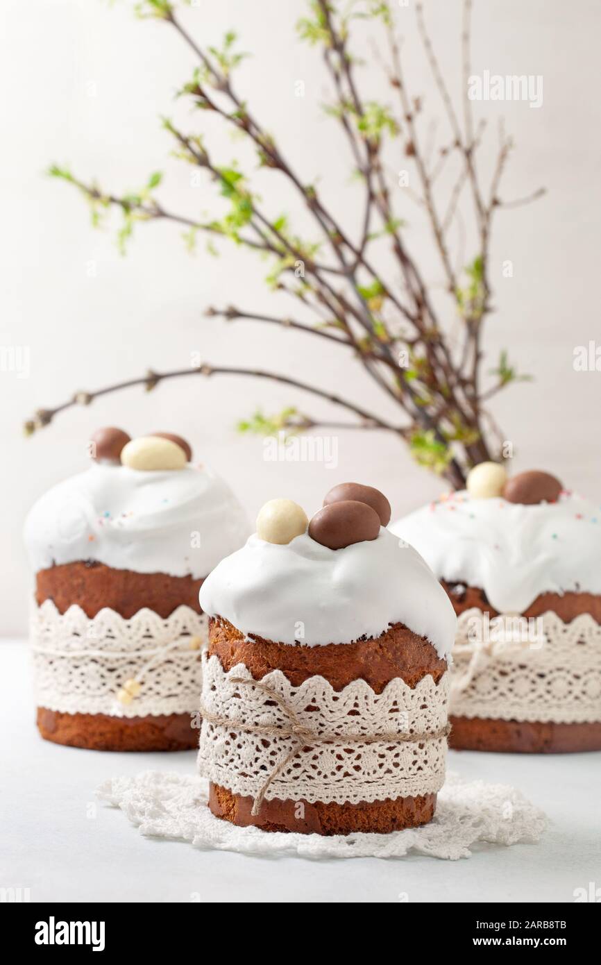 Easter composition with Easter cake (kulich), willow branches on a light background Stock Photo