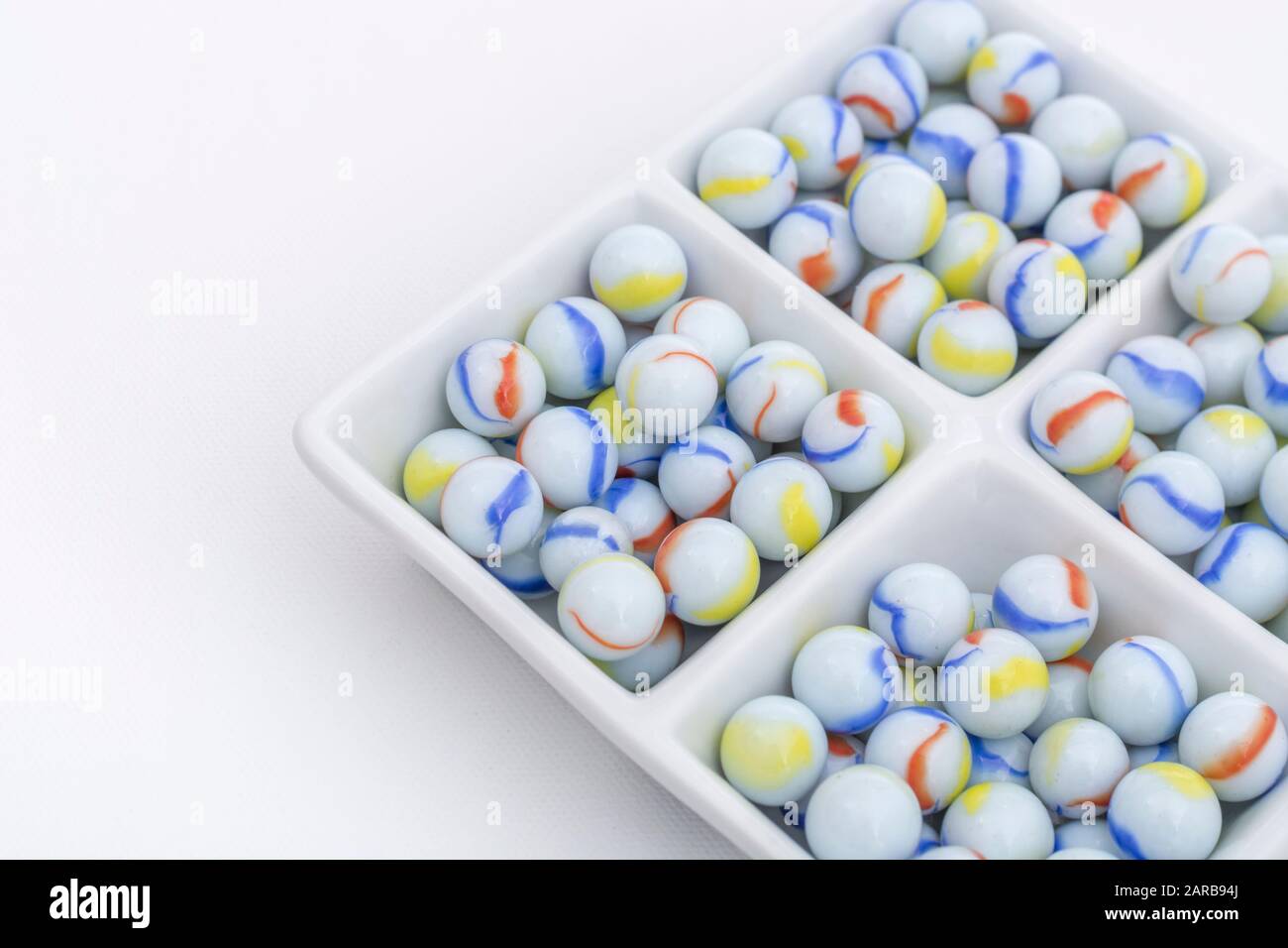 White marbles unrelated to Elgin Marbles in pottery dish as