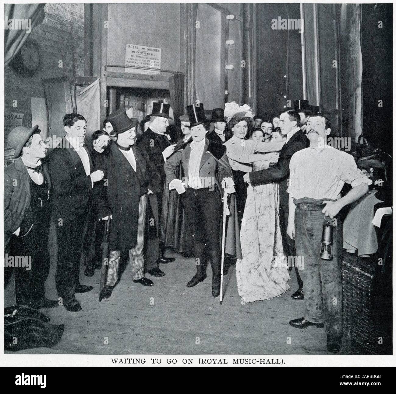 Standing in the entrance to go on stage at the Music Hall, Holborn, London.       Date: 1900 Stock Photo
