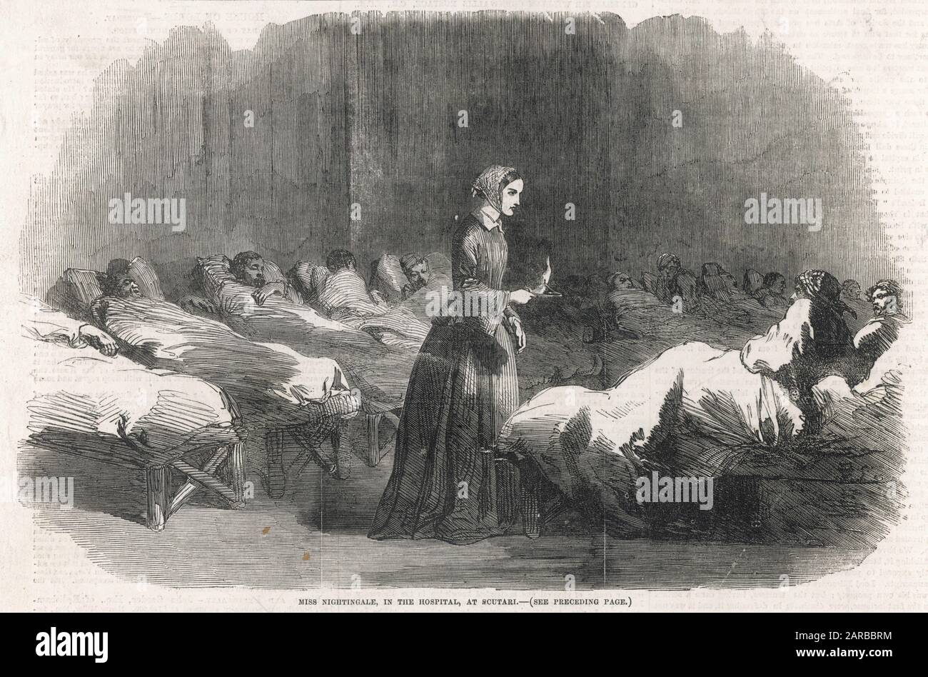 In Scutari, Florence Nightingale attends a patient during the night round.      Date: 1855 Stock Photo