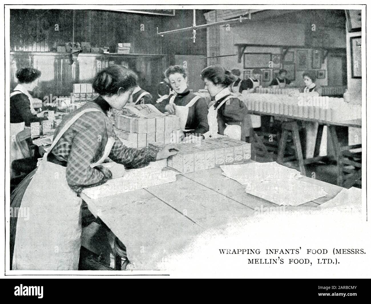 Mellin's infant food factory in London, women standing at table wrapping-up baby food.      Date: 1900 Stock Photo