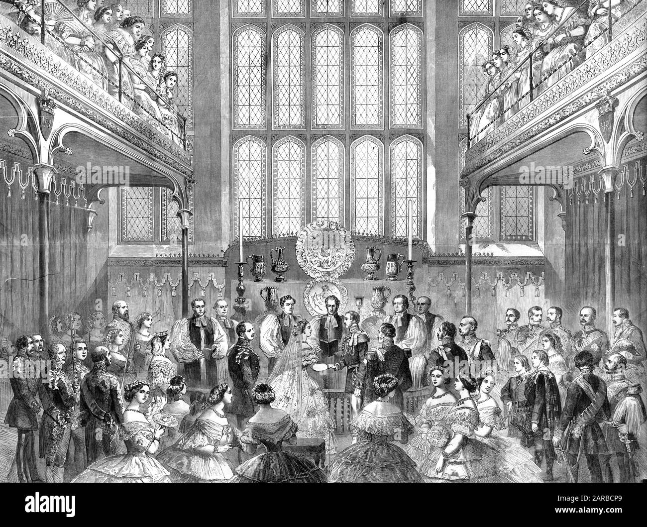 The marriage of Crown Prince Frederick William of Prussia (1831 - 1888) and the Princess Royal (1840 - 1901), eldest daughter of Queen Victoria, in the Chapel Royal at St James's Palace. The couple hold hands whilst the congregation look on.     Date: 25th January 1858 Stock Photo