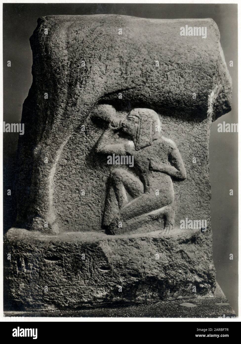 Fragment of a granite statue depicting cow goddess Hathor nursing Pharaoh Horemheb. Reign of Horemheb. New Kingdom, 18th Dynasty, ca. 1319-1292 BC.     Date: 13th century BC Stock Photo