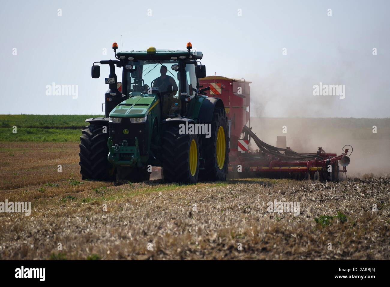 Hamersleben, Germany. 26th Aug, 2019. A high-tech tractor of the agricultural cooperative eG Hamersleben pulls a seed drill behind it for sowing. The machine inserts seeds individually and with centimetre precision into the soil. Credit: Stephan Schulz/dpa-Zentralbild/ZB/dpa/Alamy Live News Stock Photo