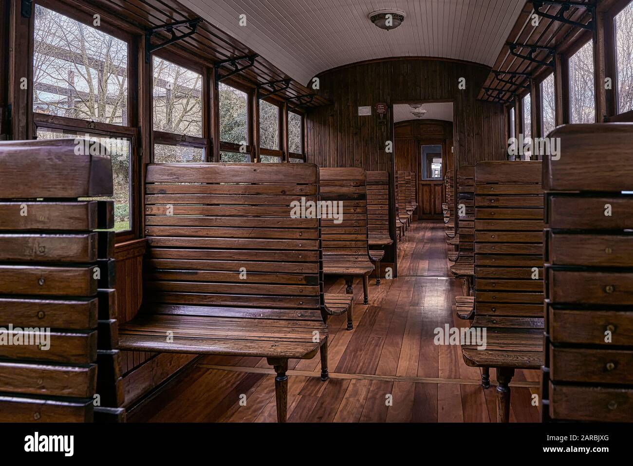 Old train car with wooden seats in the Basque Railway Museum one of the most important of its kind in Europe. Railway history of Euskadi in Azpeitia Stock Photo