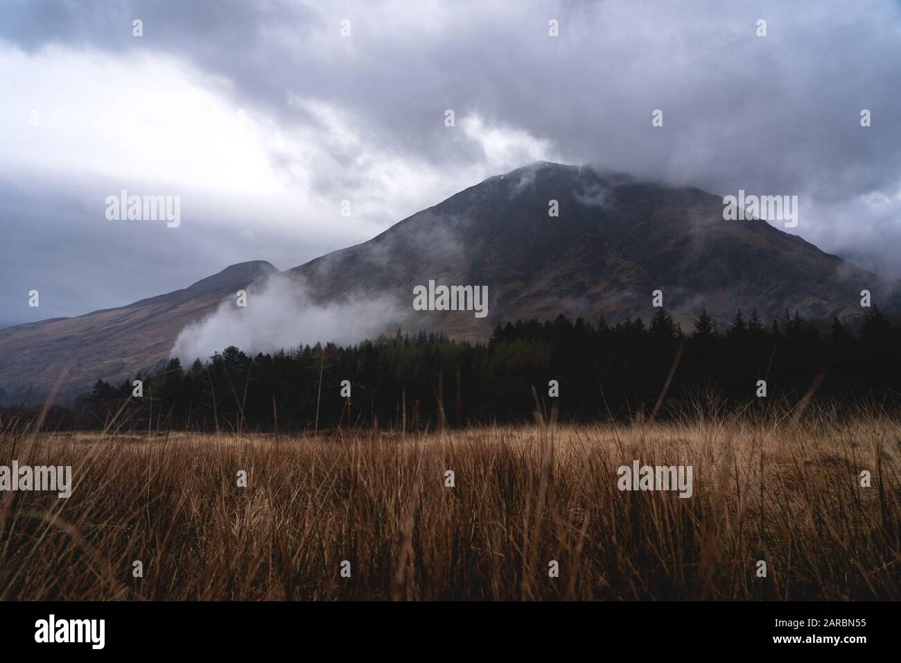 Glencoe moody mountain after rain. fog coming out of the forrest April 2019 Stock Photo