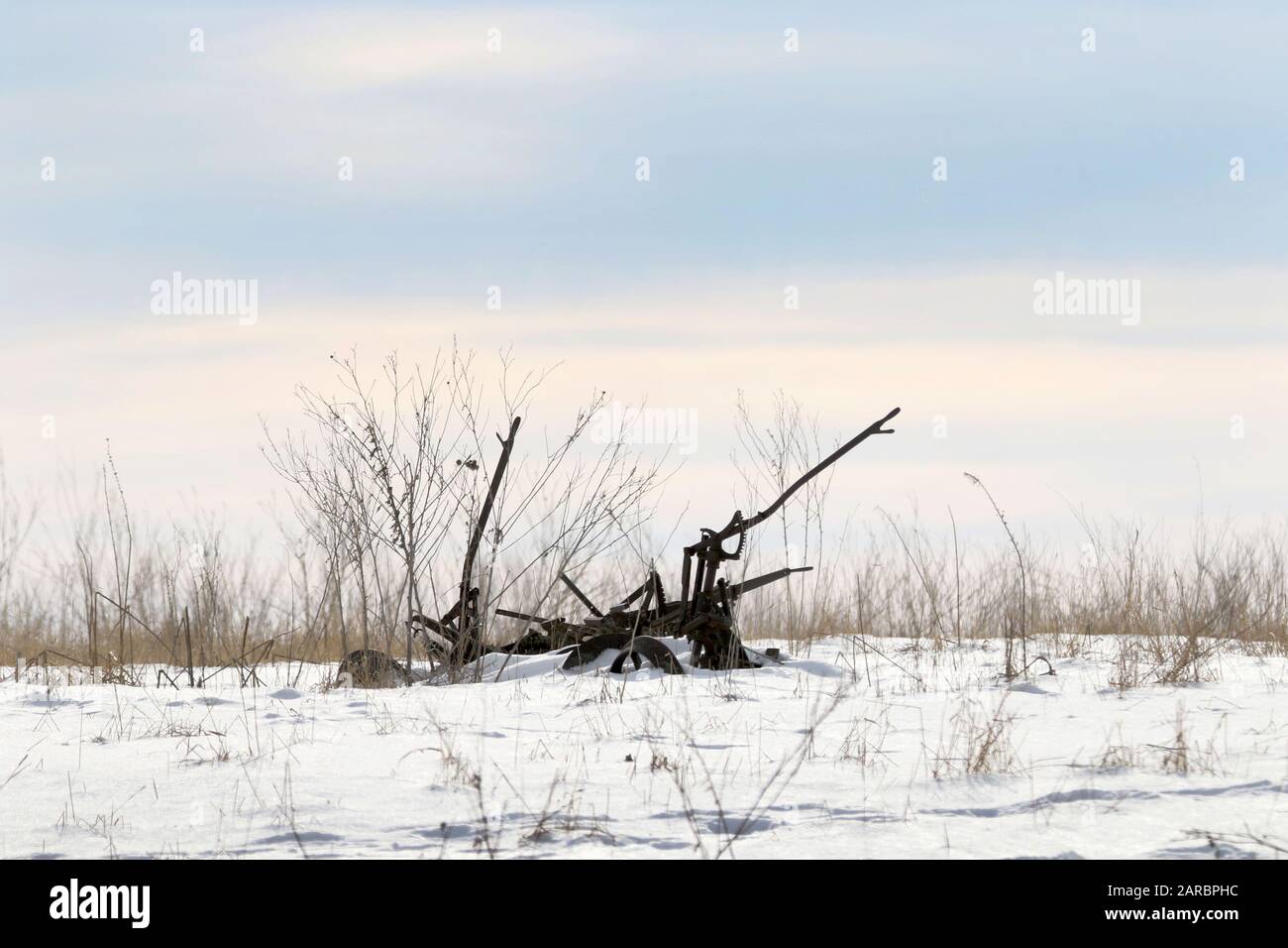 Farm Machinery in the snow Stock Photo