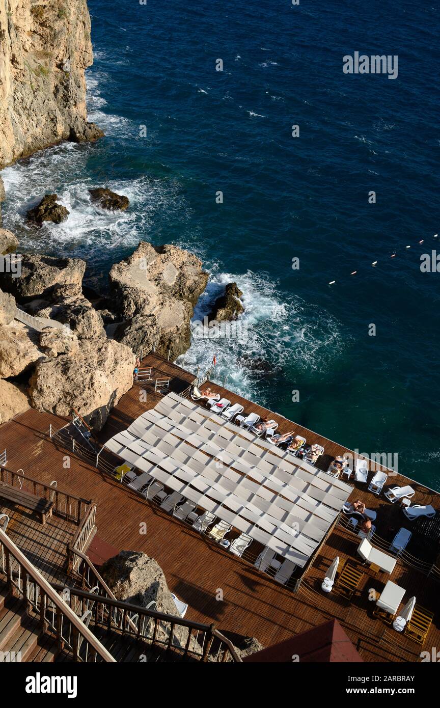 Oz Hotels in Antalya, Turkey - Seaside resort sun terrace built into the cliffs on the Mediterranean coast Stock Photo