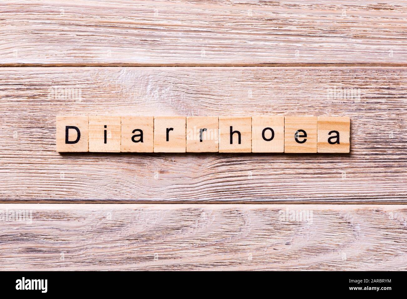 diarrhoea word written on wood block. diarrhoea text on wooden table for your desing, coronavirus concept top view. Stock Photo