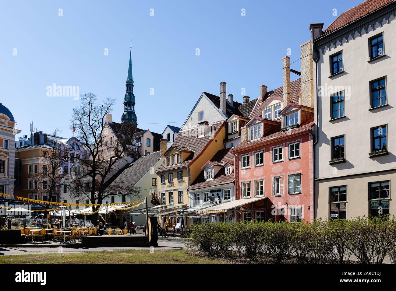 Open air restaurants and bars in a town square in Riga Stock Photo