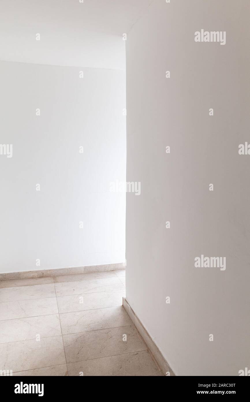Abstract empty modern interior, vertical photo of white corridor Stock Photo