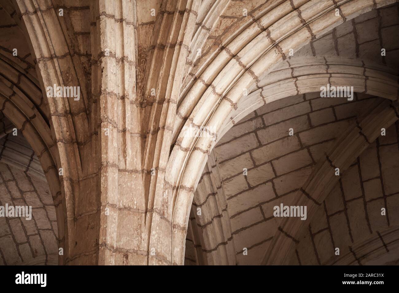 Classic Gothic column and arched vault, abstract architectural background photo Stock Photo