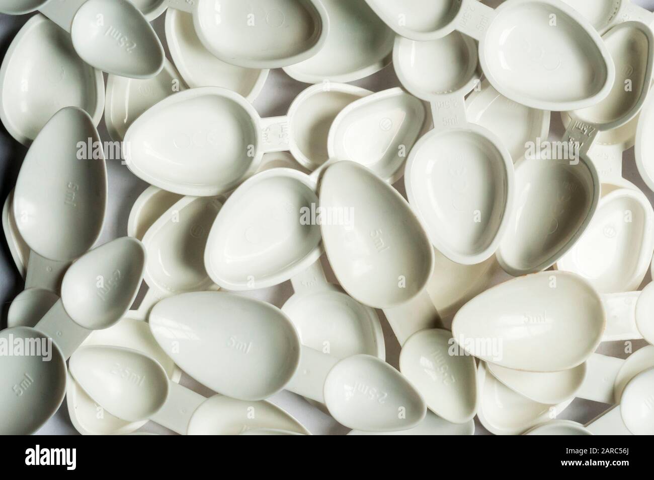 Plastic medicine measuring spoons hires stock photography and images