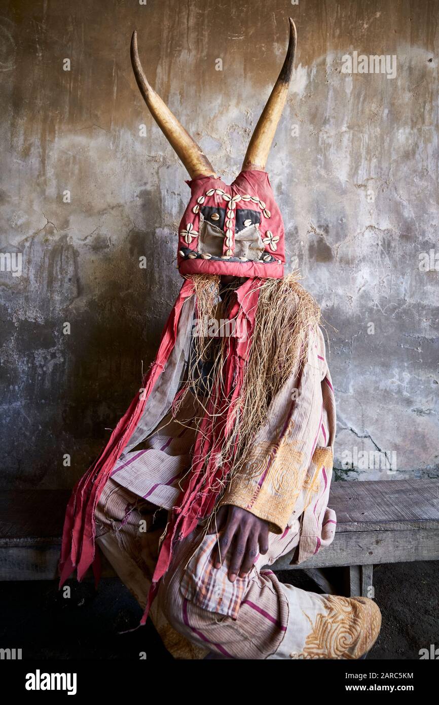 Boy in a traditional ceremonial costume of the Yoruba religion. The
