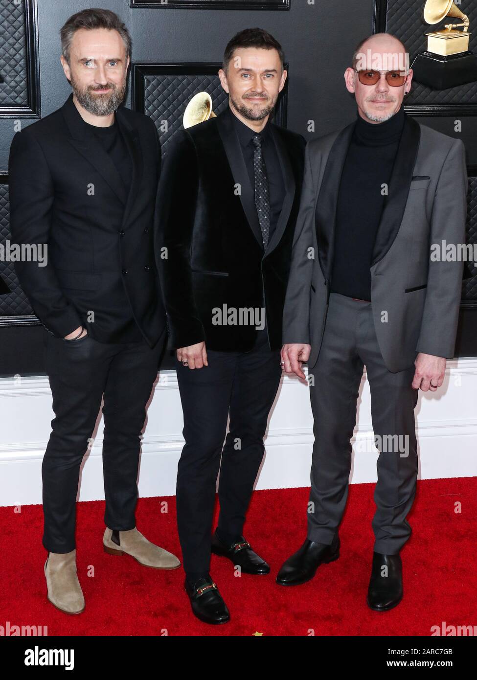 LOS ANGELES, CALIFORNIA, - JANUARY 26: Noel Hogan, Michael Gerard Hogan and Fergal Lawler of The Cranberries arrive at the 62nd Annual GRAMMY Awards at Staples Center on January 26,