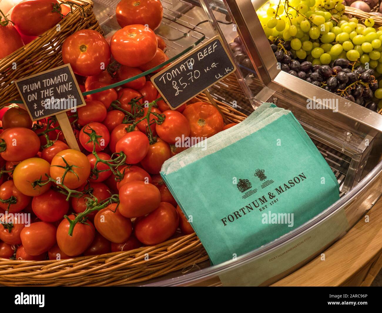Fortnum & Mason Food Hall with display of shiny perfect washed tomatoes ...