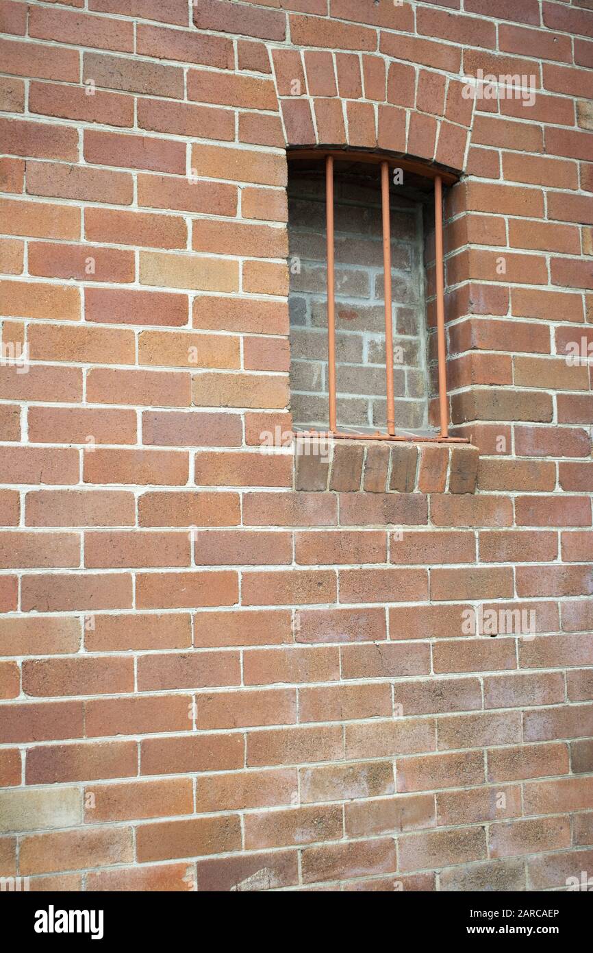 Vertical shot of a brick wall with a window during daytime Stock Photo ...