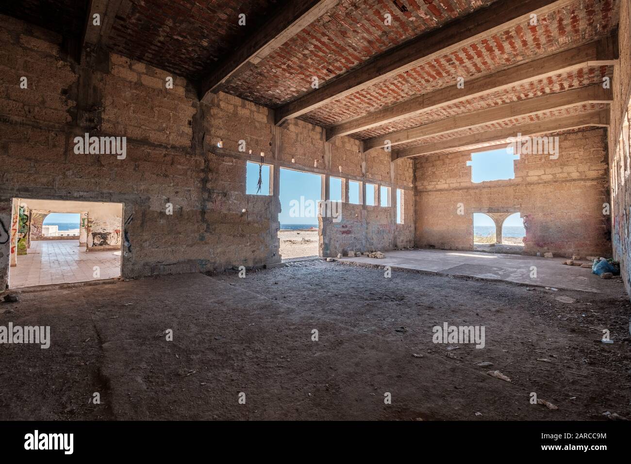 inside of abandoned warehouse or industrial ruin - run down building , empty space Stock Photo